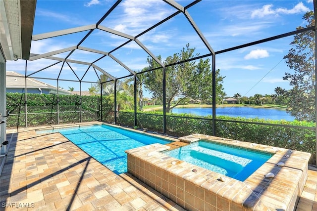 14821 Windward Ln, Naples, FL 34114 - view of swimming pool featuring glass enclosure, a water view, a pool with connected hot tub, and a patio area
