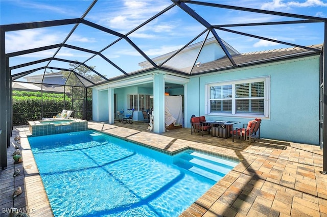 view of pool featuring a pool with connected hot tub and a patio