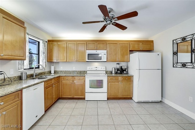 kitchen featuring light tile patterned floors, ceiling fan, a sink, light stone countertops, and white appliances