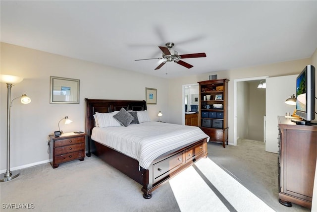 bedroom with light carpet, visible vents, a ceiling fan, and baseboards