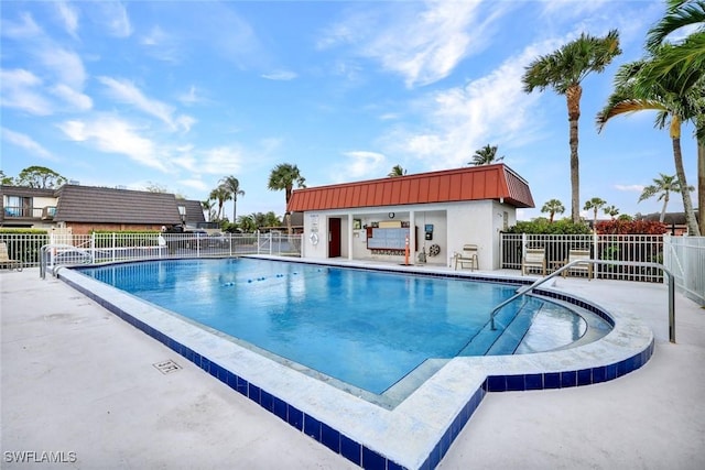 pool featuring a patio area and fence