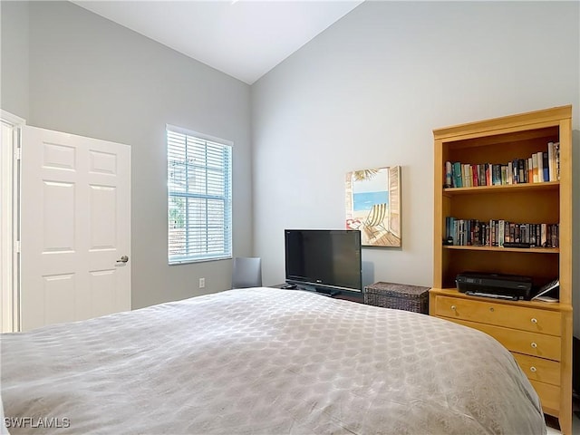 bedroom featuring lofted ceiling