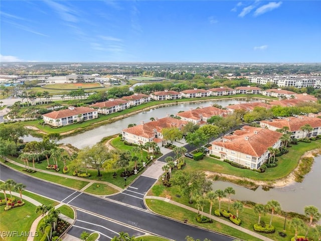 aerial view featuring a residential view and a water view