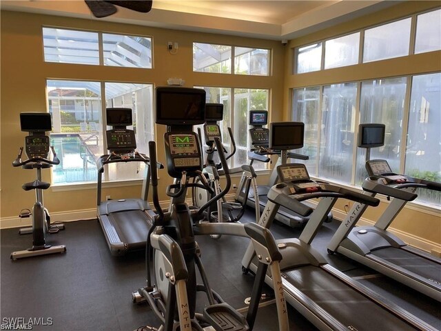 workout area featuring plenty of natural light and baseboards