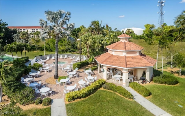 view of community with a patio area, fence, a lawn, and a gazebo