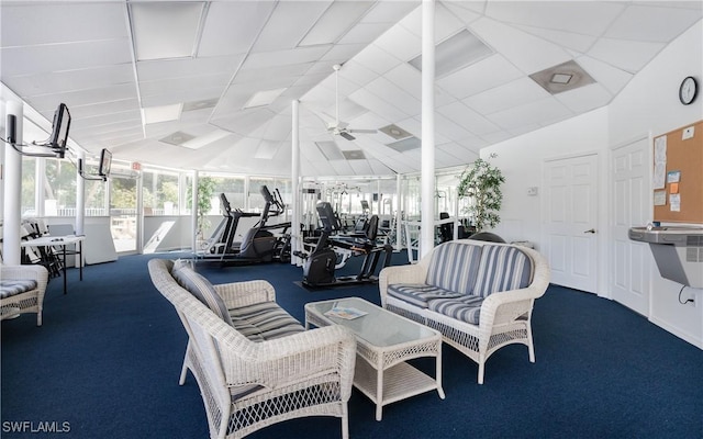 workout area featuring vaulted ceiling, carpet flooring, and a ceiling fan