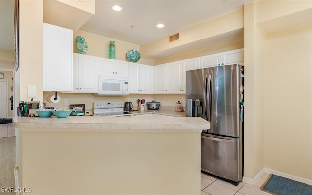 kitchen featuring light countertops, visible vents, white cabinetry, white appliances, and a peninsula