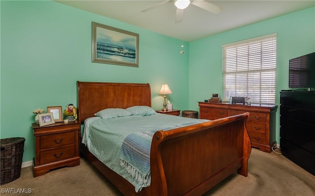 bedroom featuring light carpet and ceiling fan