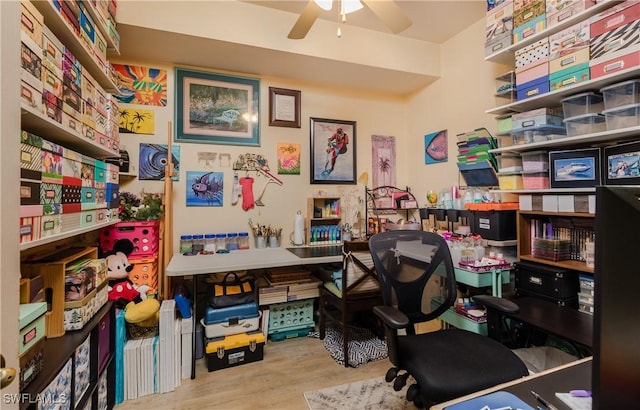 home office with ceiling fan and wood finished floors