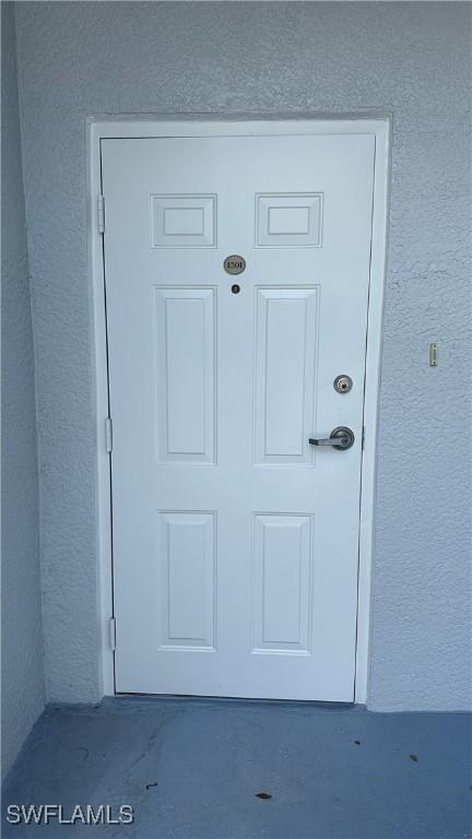 8484 Bernwood Cove Loop Unit 1301, Fort Myers, FL 33966 - view of exterior entry featuring stucco siding