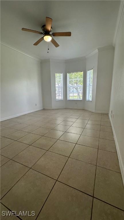 8484 Bernwood Cove Loop Unit 1301, Fort Myers, FL 33966 - tiled spare room with ornamental molding, a ceiling fan, and baseboards
