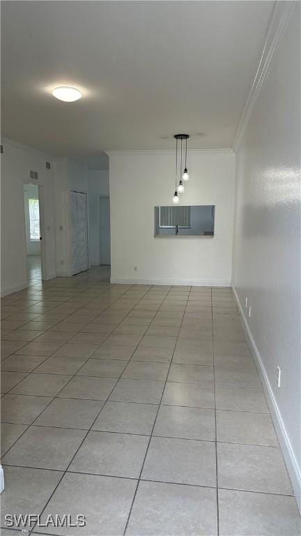 8484 Bernwood Cove Loop Unit 1301, Fort Myers, FL 33966 - unfurnished room featuring light tile patterned floors, crown molding, and baseboards