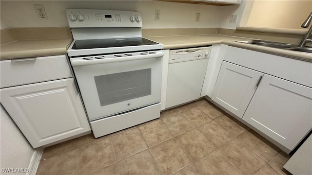 8484 Bernwood Cove Loop Unit 1301, Fort Myers, FL 33966 - kitchen featuring white appliances, a sink, white cabinetry, light countertops, and light tile patterned floors
