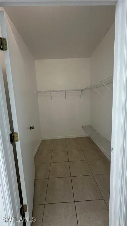 8484 Bernwood Cove Loop Unit 1301, Fort Myers, FL 33966 - walk in closet featuring light tile patterned floors