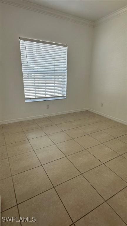8484 Bernwood Cove Loop Unit 1301, Fort Myers, FL 33966 - spare room featuring crown molding, baseboards, and light tile patterned floors