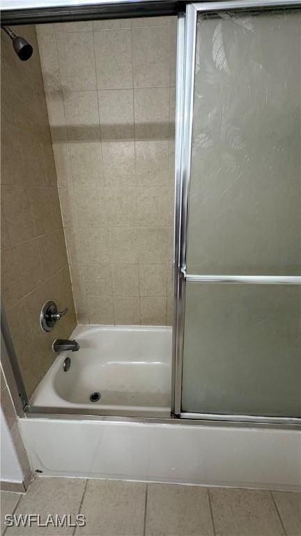 8484 Bernwood Cove Loop Unit 1301, Fort Myers, FL 33966 - bathroom featuring tile patterned flooring and enclosed tub / shower combo