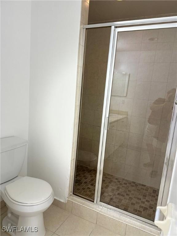8484 Bernwood Cove Loop Unit 1301, Fort Myers, FL 33966 - full bath with toilet, tile patterned floors, and a shower stall