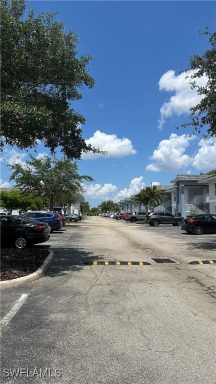 8484 Bernwood Cove Loop Unit 1301, Fort Myers, FL 33966 - view of asphalt street featuring curbs