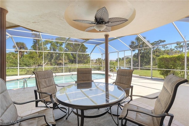 view of patio / terrace featuring glass enclosure, outdoor dining area, and an outdoor pool