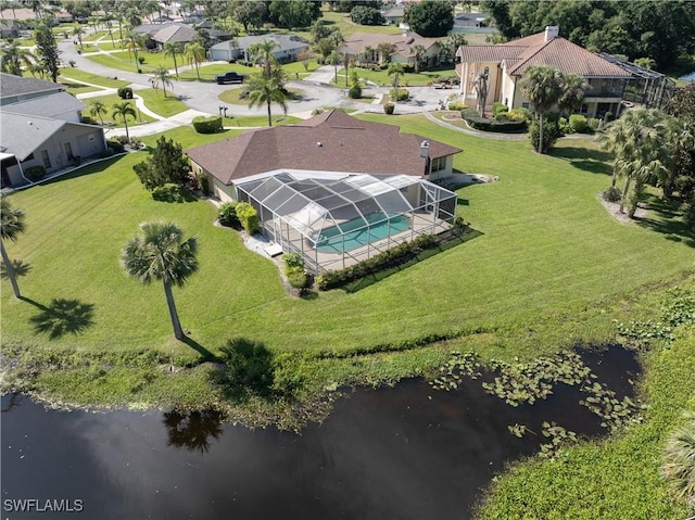 birds eye view of property with a residential view and a water view