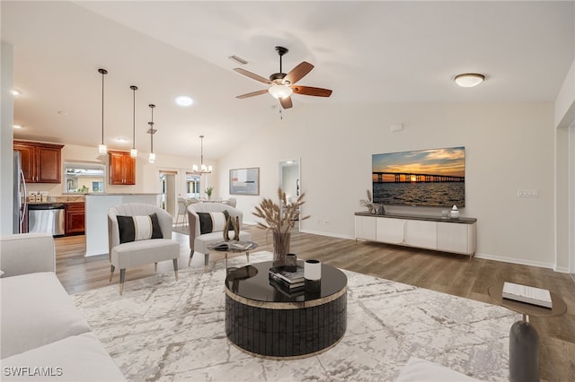 living room with light wood finished floors, visible vents, vaulted ceiling, baseboards, and ceiling fan with notable chandelier