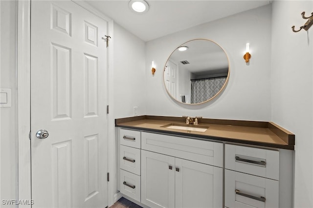 bathroom featuring visible vents and vanity