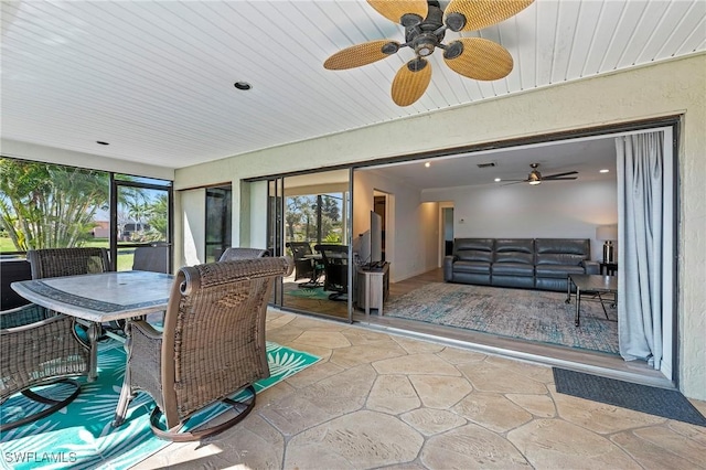 sunroom / solarium with wooden ceiling and visible vents