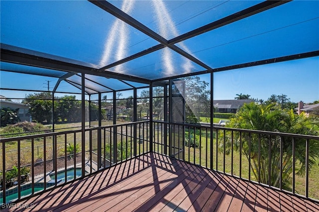 exterior space with a lanai and an outdoor pool