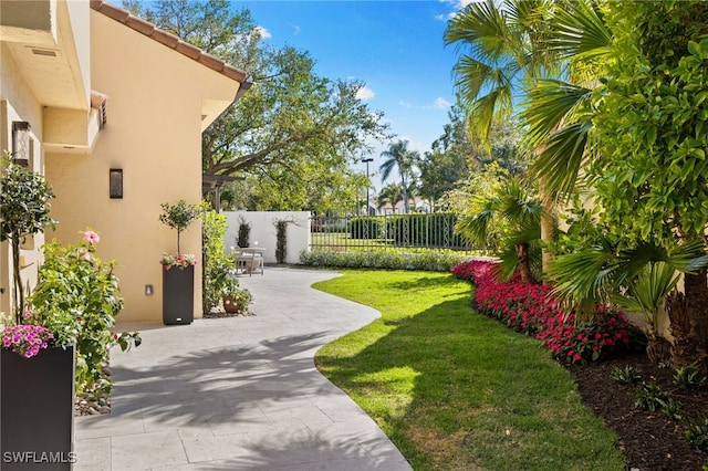 view of yard with a patio area and fence