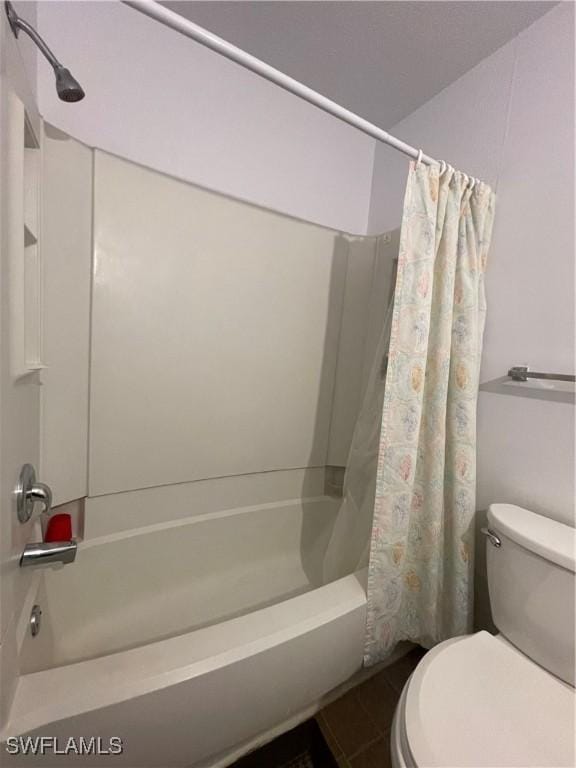 full bath featuring toilet, tile patterned flooring, and shower / bath combo