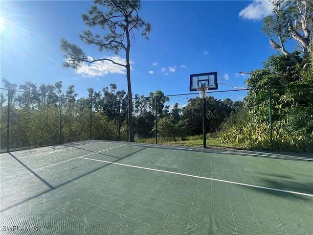 view of sport court featuring community basketball court and fence