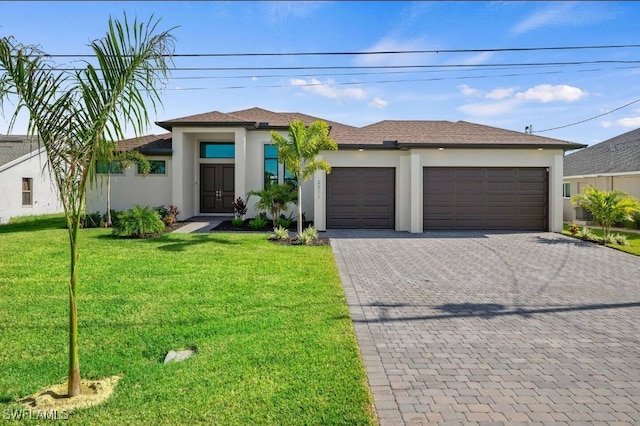 view of front facade with an attached garage, a front lawn, decorative driveway, and stucco siding