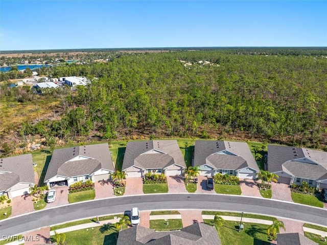 aerial view with a forest view and a residential view