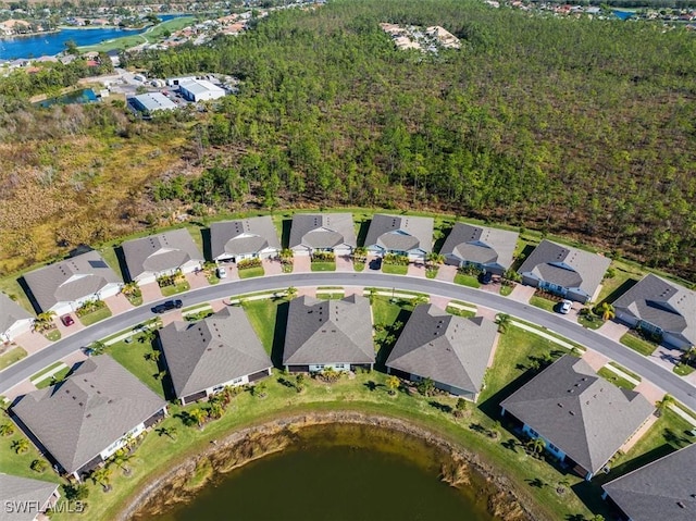 bird's eye view featuring a residential view and a water view