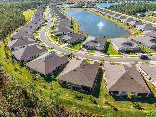 bird's eye view featuring a water view and a residential view