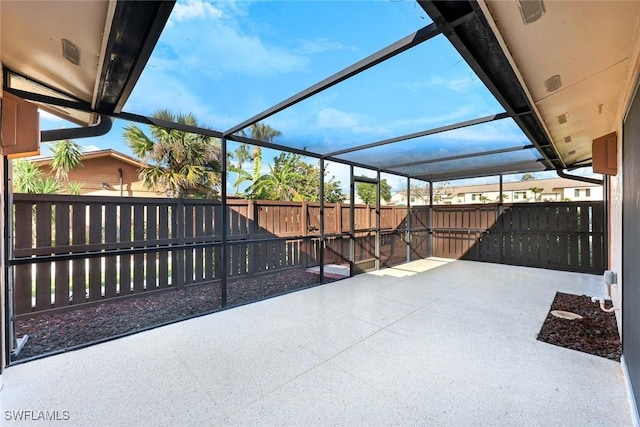 view of patio / terrace featuring a fenced backyard and a lanai