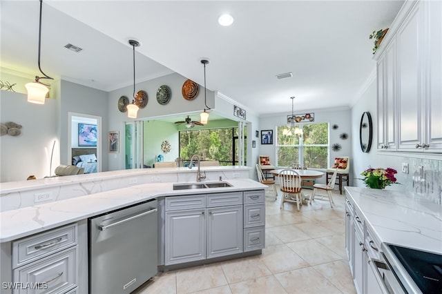 8732 Banyan Bay Blvd, Fort Myers, FL 33908 - kitchen with stainless steel dishwasher, crown molding, gray cabinets, range, and light stone counters