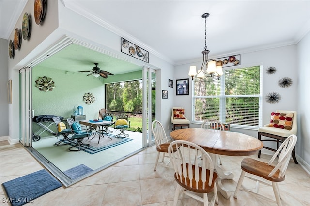 dining room featuring ornamental molding, plenty of natural light, baseboards, and light tile patterned floors