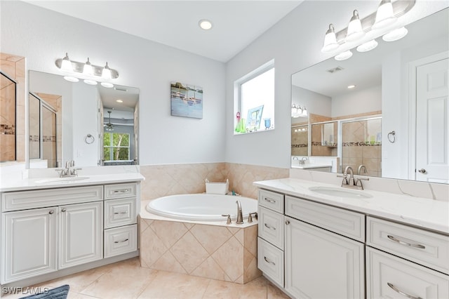 8732 Banyan Bay Blvd, Fort Myers, FL 33908 - bathroom featuring a shower stall, two vanities, a bath, and plenty of natural light