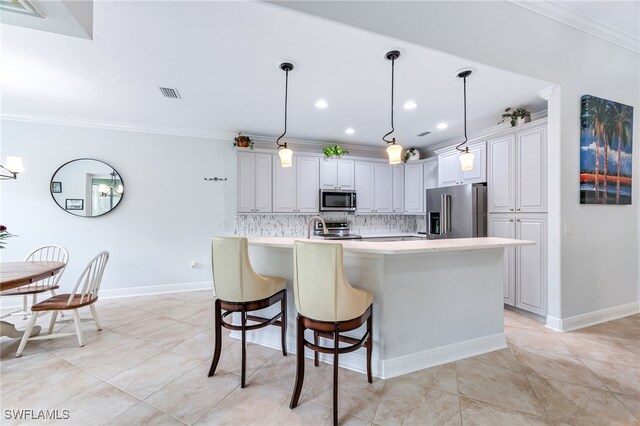 kitchen with stainless steel appliances, visible vents, light countertops, ornamental molding, and decorative backsplash