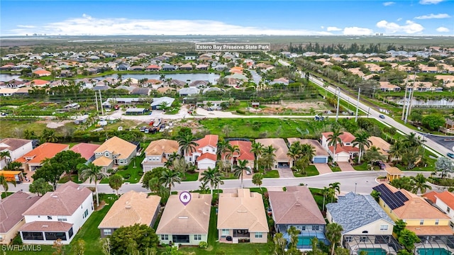 bird's eye view with a water view and a residential view