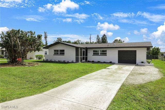 single story home with an attached garage, fence, driveway, stucco siding, and a front yard