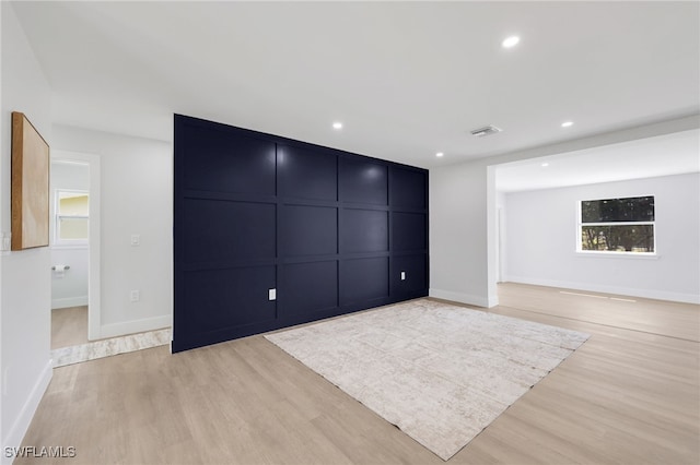 interior space with recessed lighting, baseboards, visible vents, and light wood finished floors