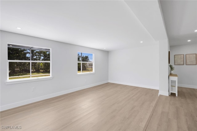 interior space with recessed lighting, light wood-type flooring, and baseboards