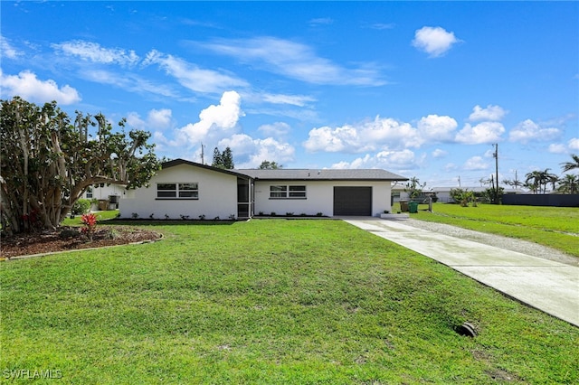 ranch-style home with a garage, stucco siding, concrete driveway, and a front yard