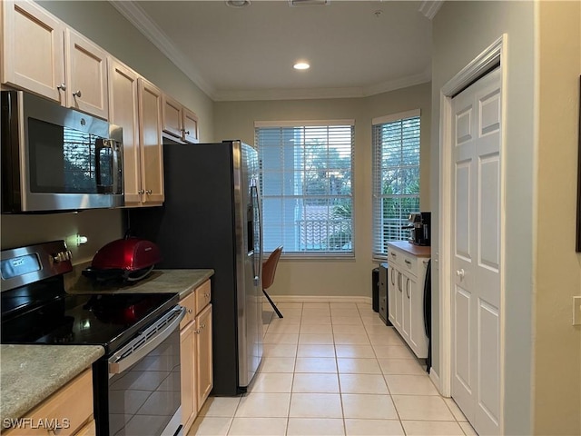 kitchen with light tile patterned flooring, recessed lighting, light countertops, ornamental molding, and appliances with stainless steel finishes