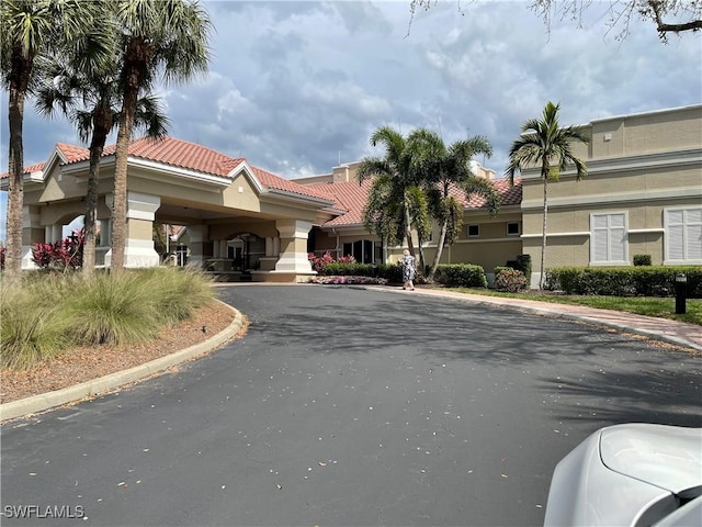 view of property with aphalt driveway