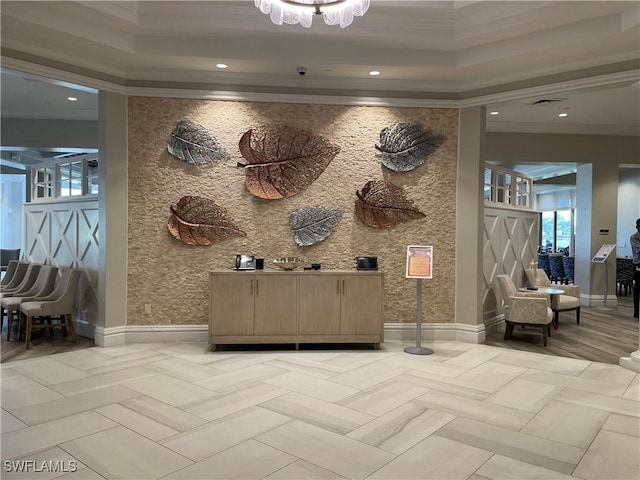 interior space featuring visible vents and a notable chandelier