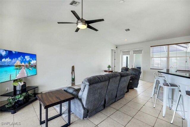 living area with light tile patterned flooring, visible vents, and french doors