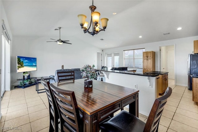 dining space featuring light tile patterned flooring, plenty of natural light, recessed lighting, and ceiling fan with notable chandelier